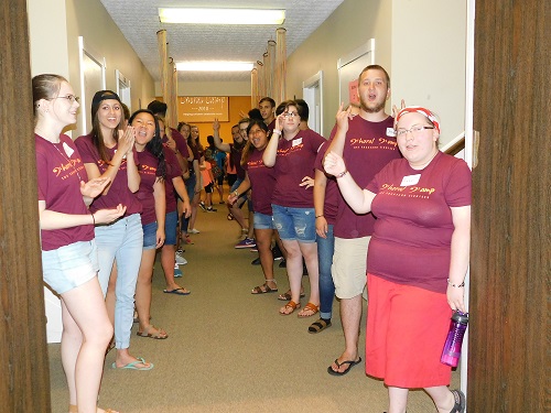 Students welcoming people to Choral Camp.