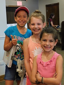 Three Girls Smiling at Camp